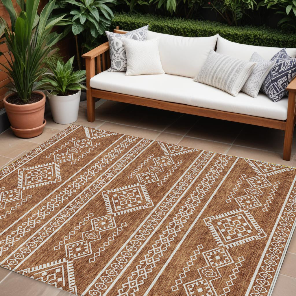 10' X 14' Orange And Ivory Southwestern Washable Indoor Outdoor Area Rug
